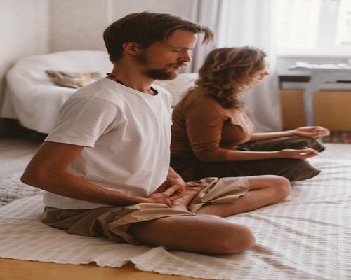 Woman practicing mindfulness and deep breathing in a quiet room